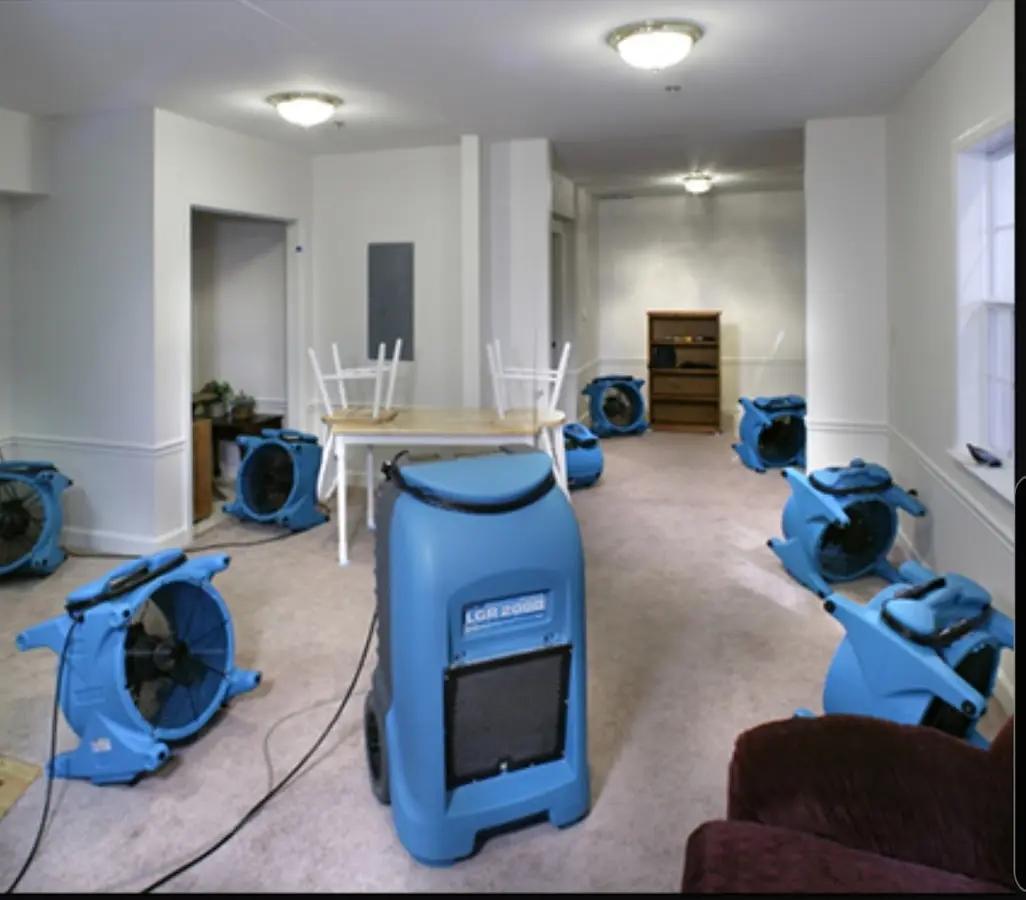 Air movers and dehumidifier setup for Water Damage Restoration in University Heights